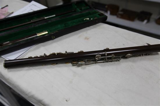 A Rudall Carte & Co. rosewood flute, no. 7340, flute 26.5in.